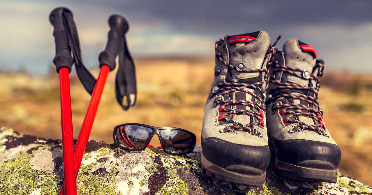 Travel essentials for your walking holiday including poles, sunglasses and boots
